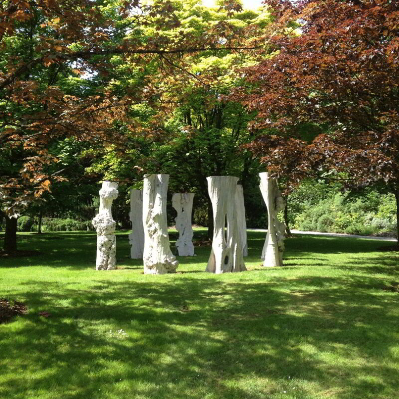 Sentinel sculptures displayed in an outdoor setting.