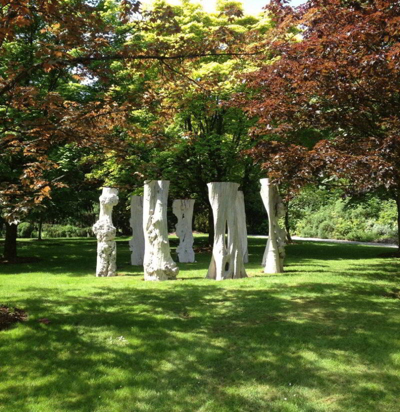 Sentinel sculptures displayed in an outdoor setting.