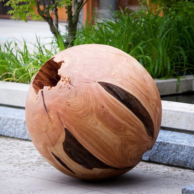 Western red cedar sphere in an outdoor setting.