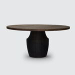 Tafoni Dining table with a Western Red Cedar top and scorched base against a white background.