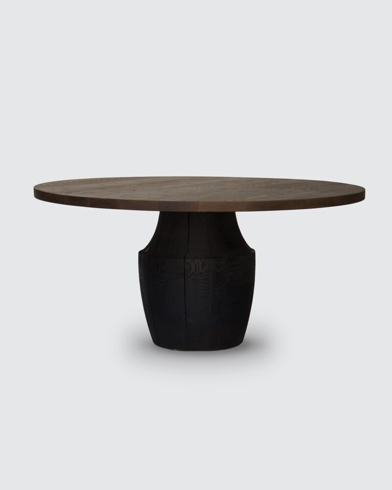 Tafoni Dining table with a Western Red Cedar top and scorched base against a white background.
