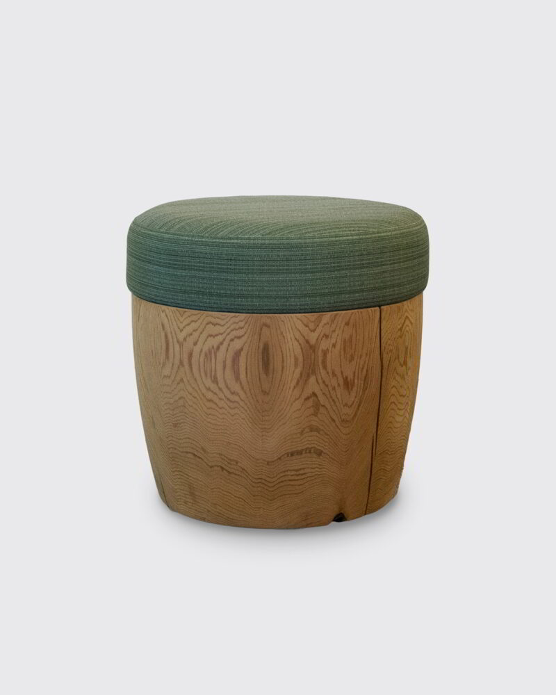 Drum with a green woven pouf.