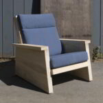 Pesuta chair made from Accoya with dark blue cushions.