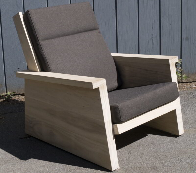 Pesuta chair made from Accoya with black cushions.