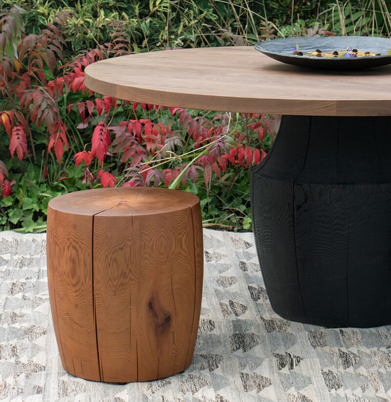 Dr-2 drum and tafoni dining table in an exterior setting.