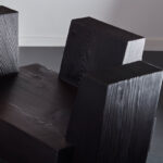 The beton brut chair is pictured in detail in the studio.