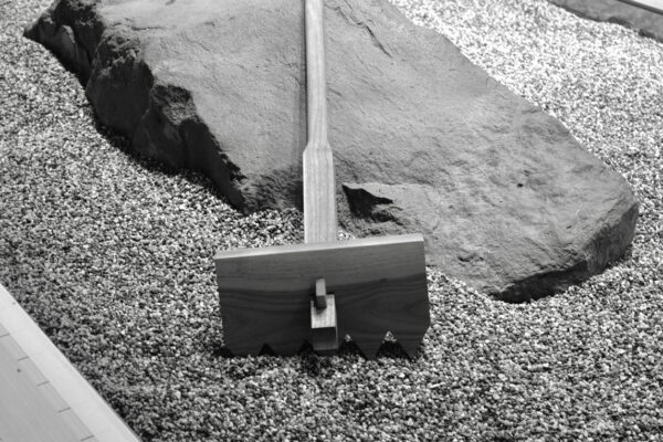 a wood rake was used to rake the gravel around the rocks